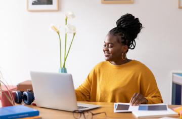 Young black female entrepreneur working from home